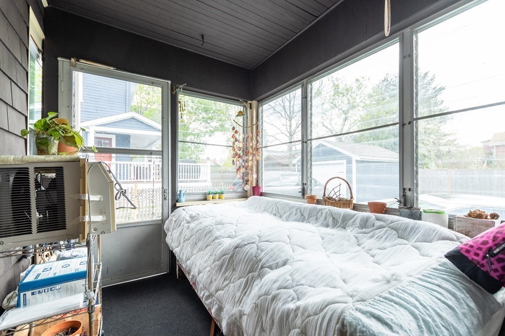 57 Cook Street Newton, MA 02458 - Photo 12 of 28 a bedroom with a bed and a large window