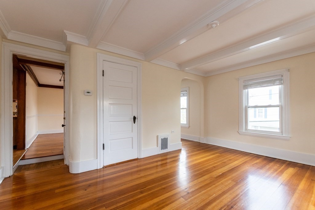 57 Cook Street Newton, MA 02458 - Photo 20 of 28 a view of empty room with wooden floor and fan