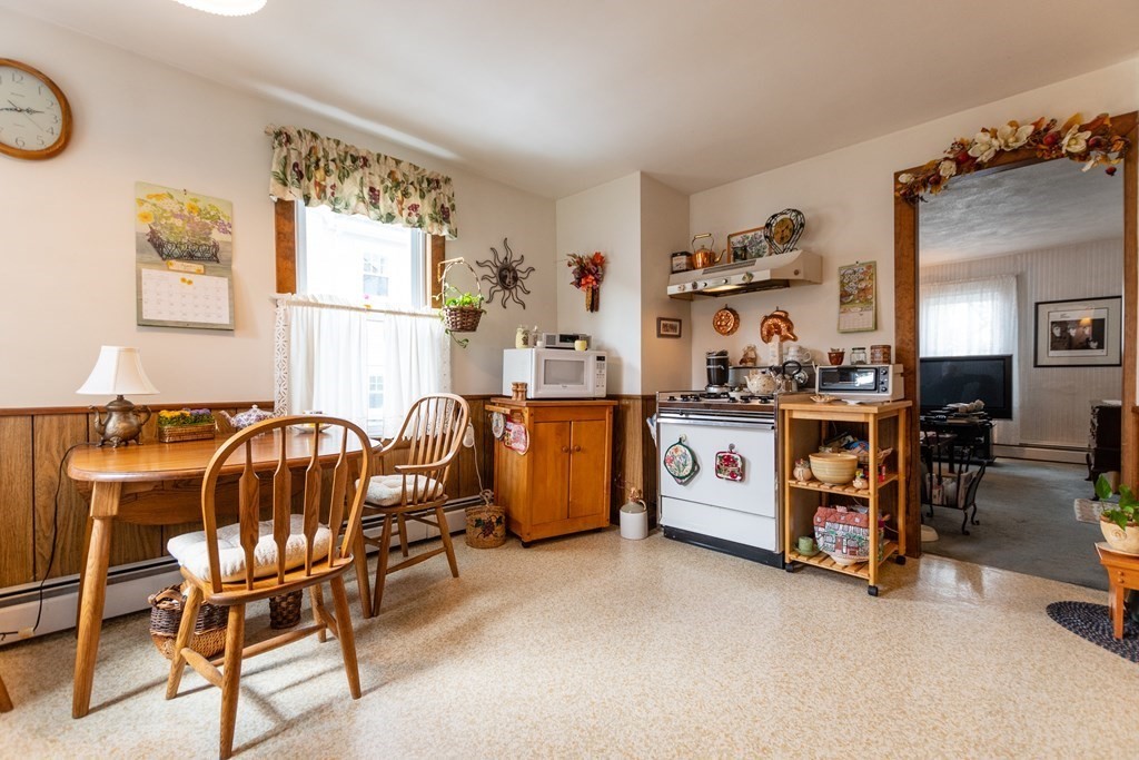57 Cook Street Newton, MA 02458 - Photo 2 of 28 a room with furniture and a window