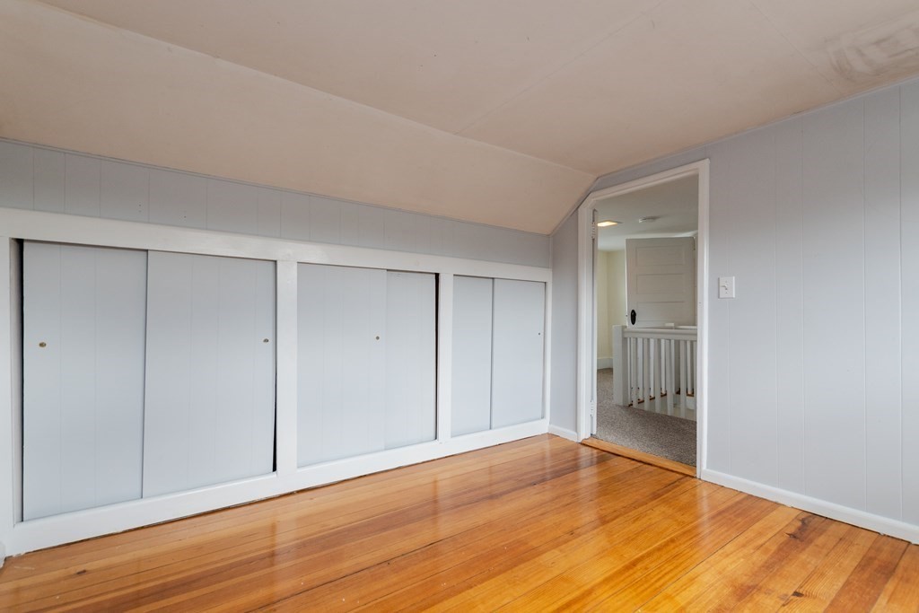 57 Cook Street Newton, MA 02458 - Photo 21 of 28 a view of an empty room and wooden floor