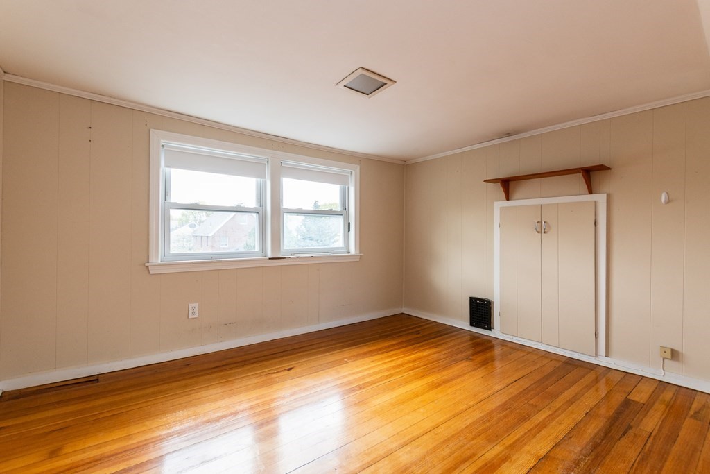 57 Cook Street Newton, MA 02458 - Photo 22 of 28 a view of empty room with wooden floor and fan