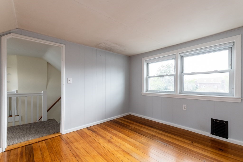 57 Cook Street Newton, MA 02458 - Photo 23 of 28 a view of empty room with wooden floor and fan