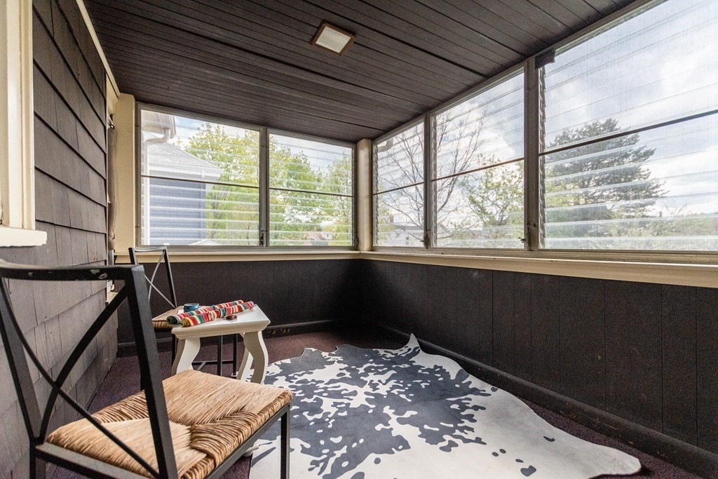 57 Cook Street Newton, MA 02458 - Photo 26 of 28 a living room with a couch and a table