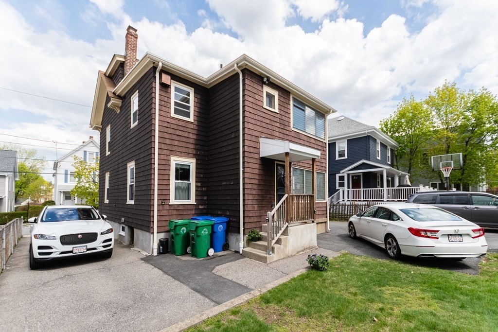 57 Cook Street Newton, MA 02458 - Photo 28 of 28 a car parked in front of a house