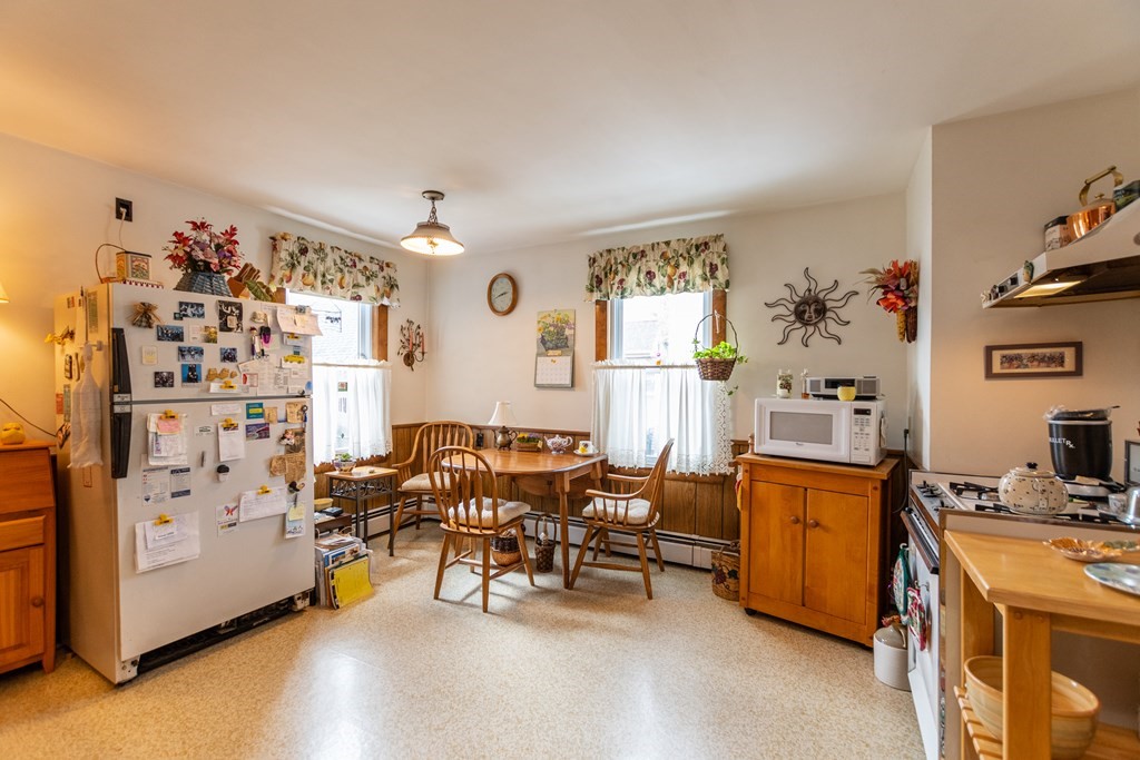 57 Cook Street Newton, MA 02458 - Photo 4 of 28 a view of a workspace with furniture and a livingroom