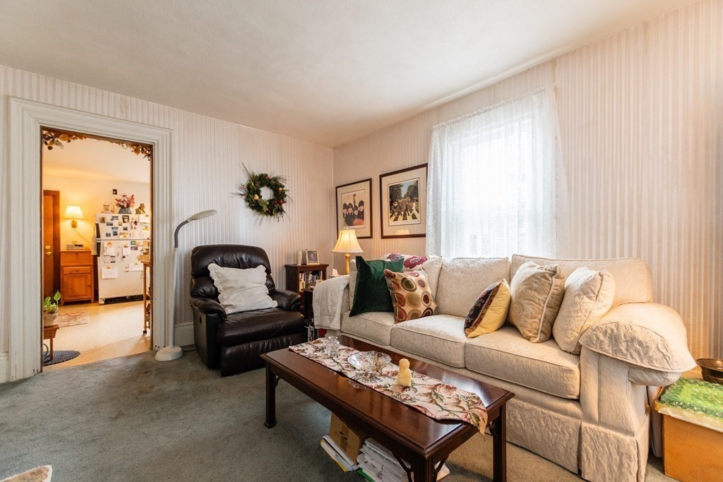 57 Cook Street Newton, MA 02458 - Photo 7 of 28 a living room with furniture and a window
