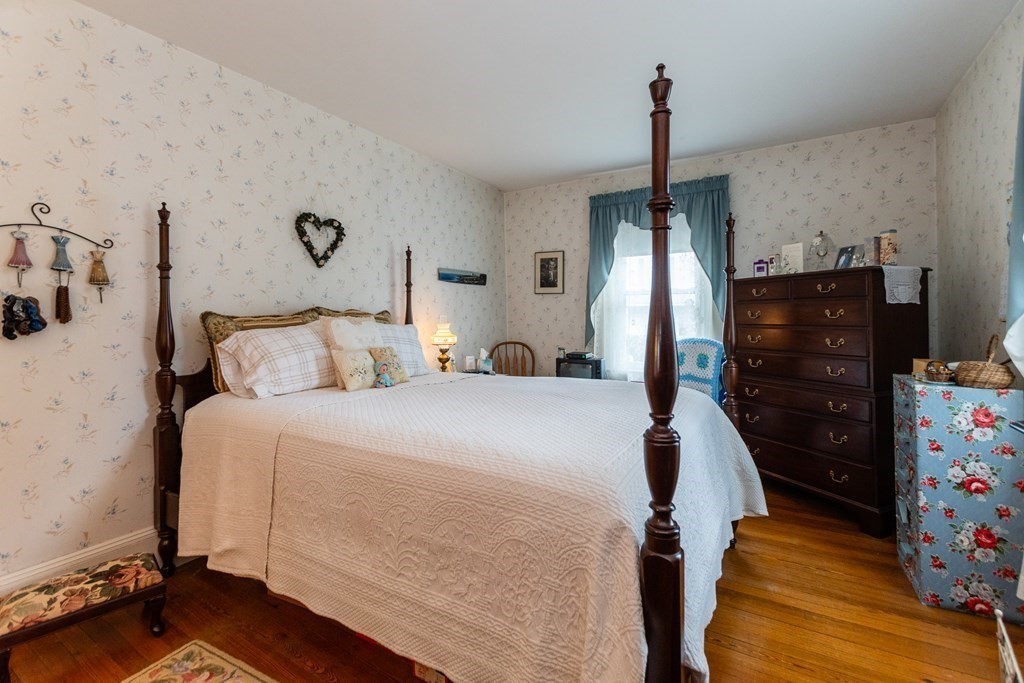 57 Cook Street Newton, MA 02458 - Photo 8 of 28 a bedroom with a bed and wooden floor