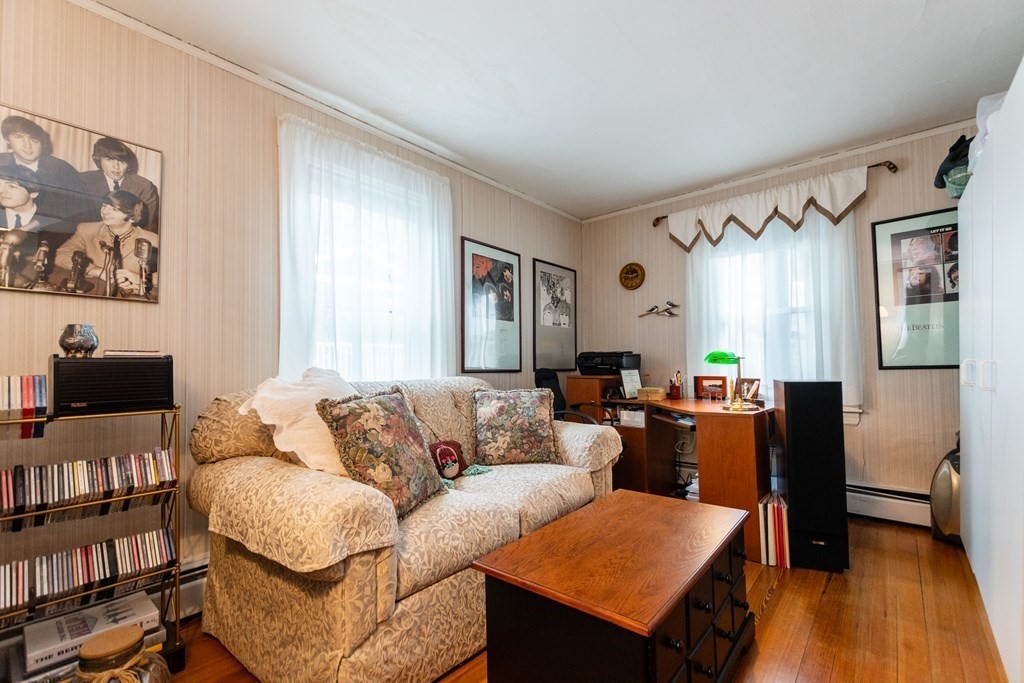 57 Cook Street Newton, MA 02458 - Photo 10 of 28 a living room with furniture and a flat screen tv