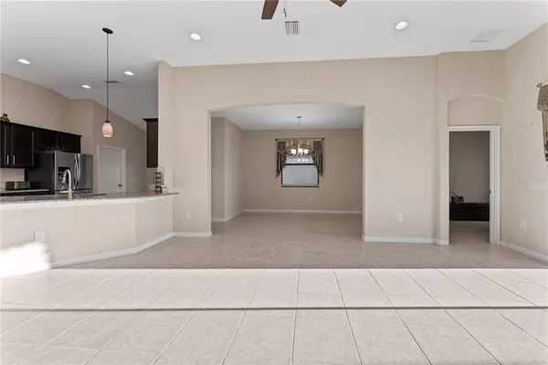 a view of a living room and kitchen