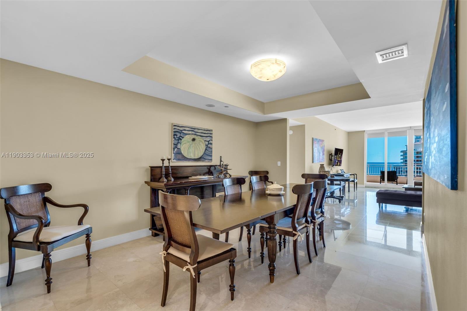 791 Crandon Boulevard, Unit 1402 Key Biscayne, FL 33149 - Photo 16 of 56 a view of a dining room with furniture and a potted plant