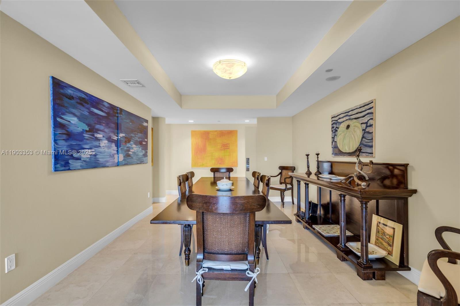791 Crandon Boulevard, Unit 1402 Key Biscayne, FL 33149 - Photo 17 of 56 a view of a dining room with furniture a chandelier and wooden floor