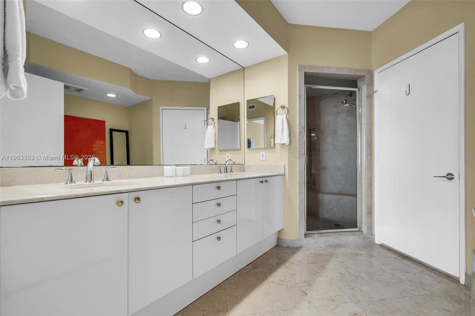 791 Crandon Boulevard, Unit 1402 Key Biscayne, FL 33149 - Photo 21 of 56 a spacious bathroom with a granite countertop sink mirror and double