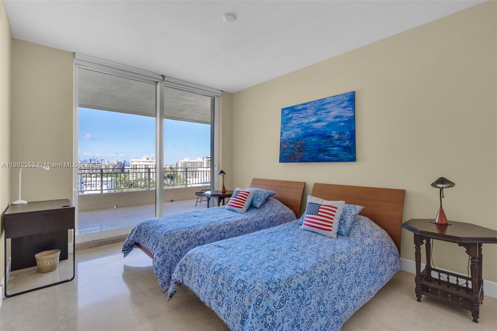 791 Crandon Boulevard, Unit 1402 Key Biscayne, FL 33149 - Photo 26 of 56 a bedroom with a large bed and a window