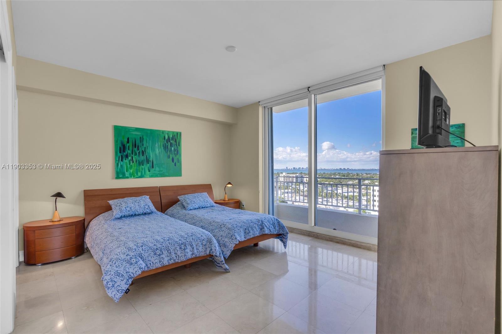 791 Crandon Boulevard, Unit 1402 Key Biscayne, FL 33149 - Photo 30 of 56 a bedroom with a bed and large window