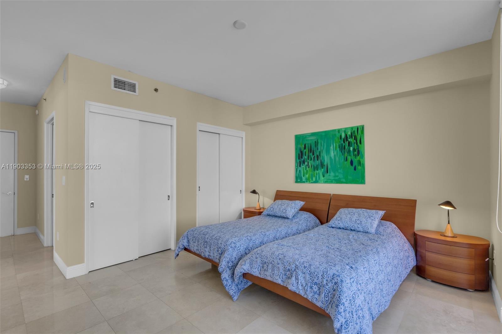 791 Crandon Boulevard, Unit 1402 Key Biscayne, FL 33149 - Photo 31 of 56 a bedroom with a bed and window