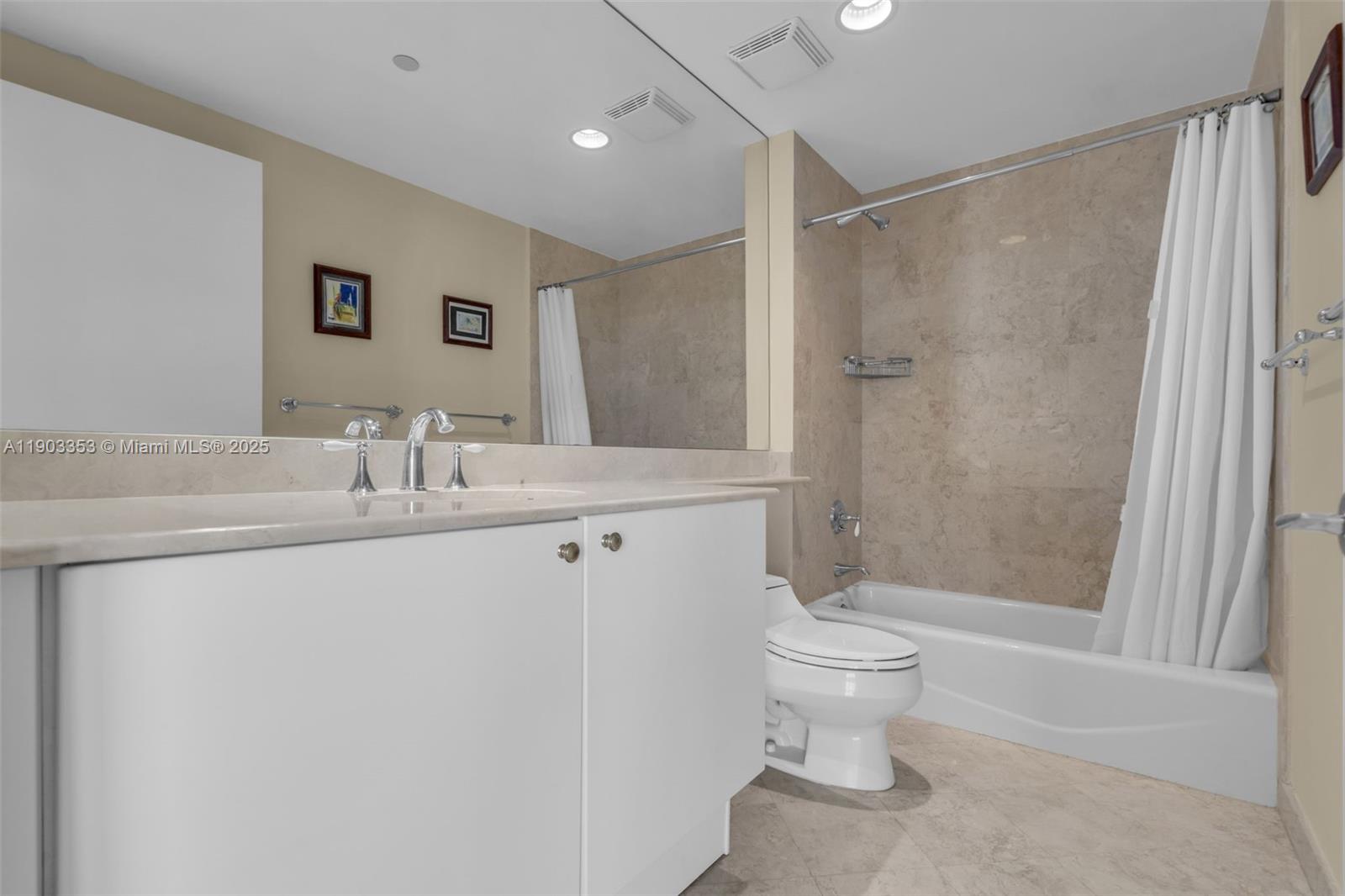 791 Crandon Boulevard, Unit 1402 Key Biscayne, FL 33149 - Photo 33 of 56 a bathroom with a sink toilet and shower