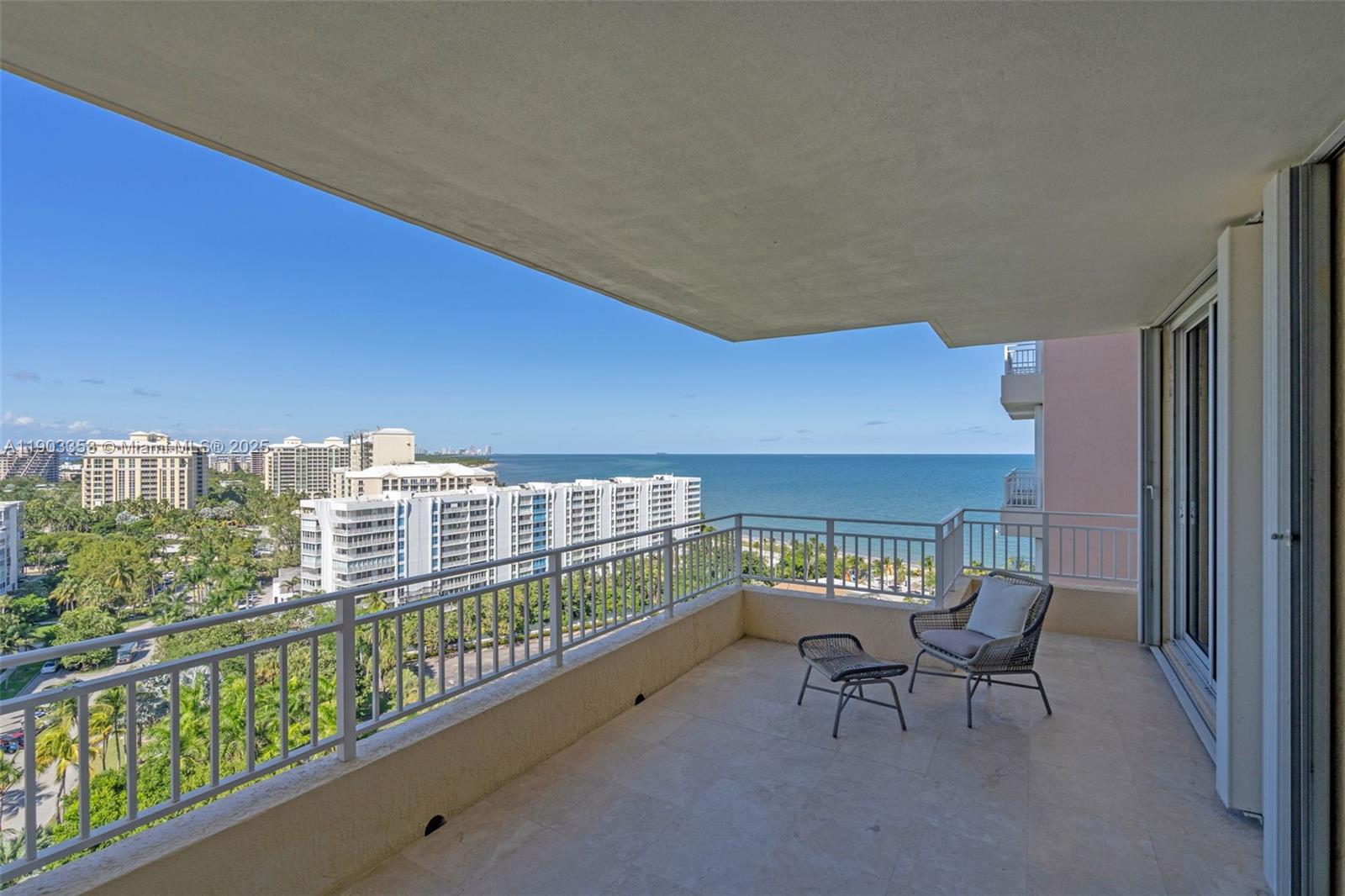 791 Crandon Boulevard, Unit 1402 Key Biscayne, FL 33149 - Photo 38 of 56 a view of a balcony with chairs