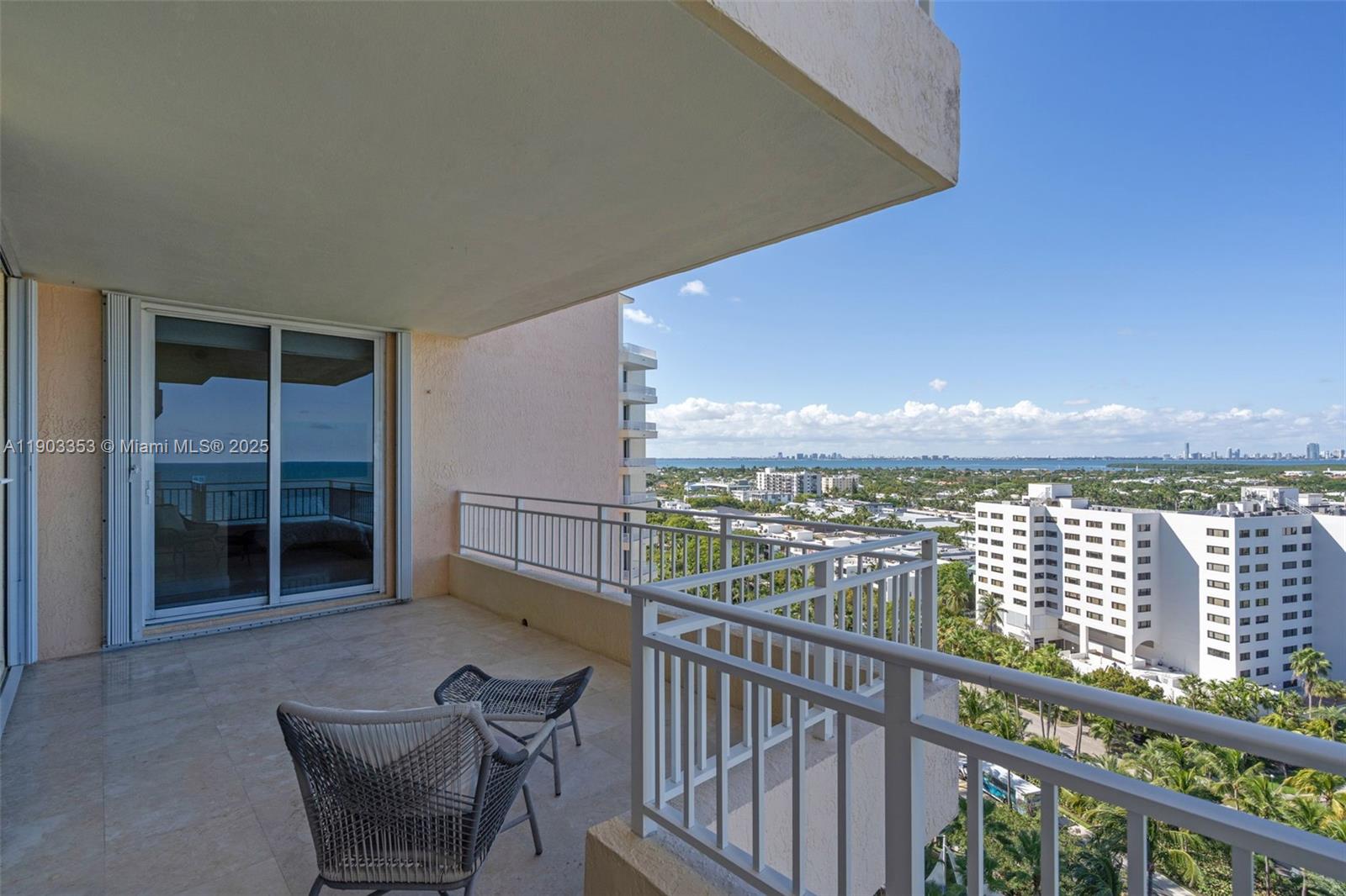 791 Crandon Boulevard, Unit 1402 Key Biscayne, FL 33149 - Photo 39 of 56 a view of a balcony with chair and floor to ceiling window