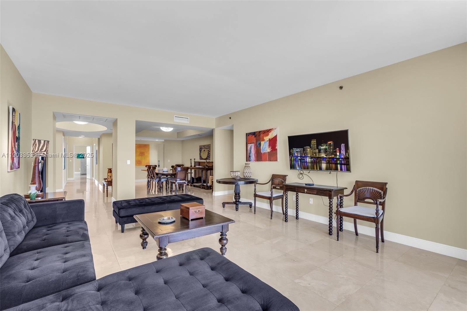 791 Crandon Boulevard, Unit 1402 Key Biscayne, FL 33149 - Photo 8 of 56 a living room with furniture a rug and a table