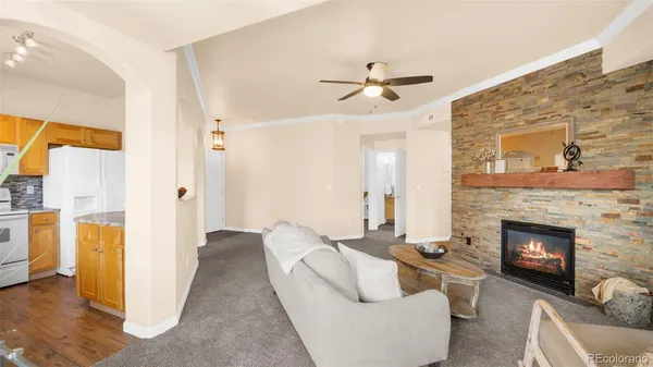 a living room with furniture and a fireplace