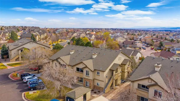 an aerial view of residential houses with outdoor space