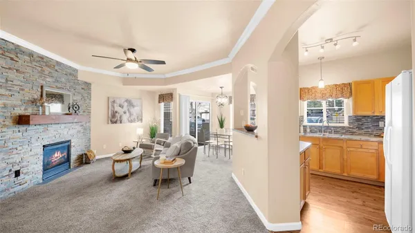 a living room with furniture and a fireplace