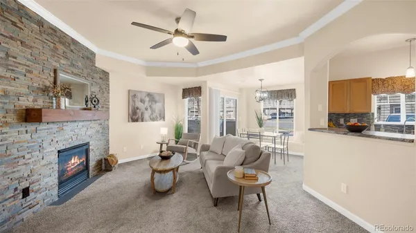a living room with furniture and a fireplace