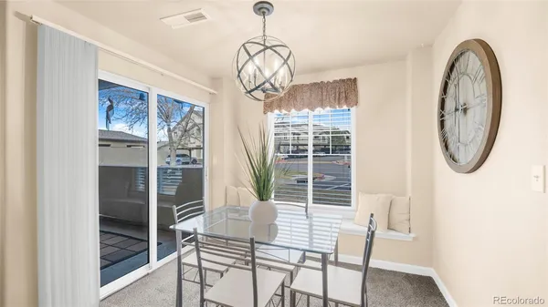 a view of a livingroom with furniture and window