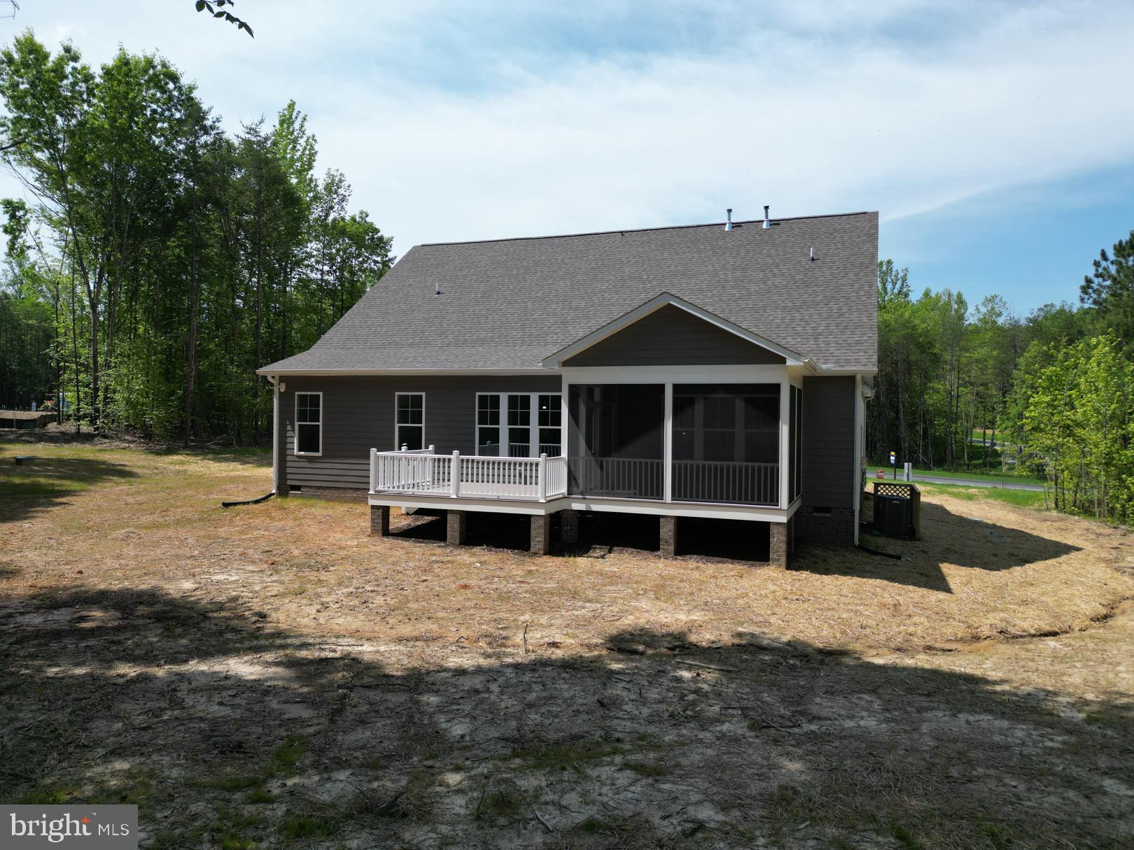 16877 Watchman Way Beaverdam, VA 23015 - Photo 8 of 10 a front view of a house with a yard covered in snow
