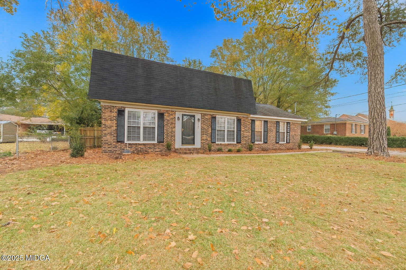 1303 Forest Hill Road Macon, GA 31210 - Photo 2 of 54 a front view of a house with a garden