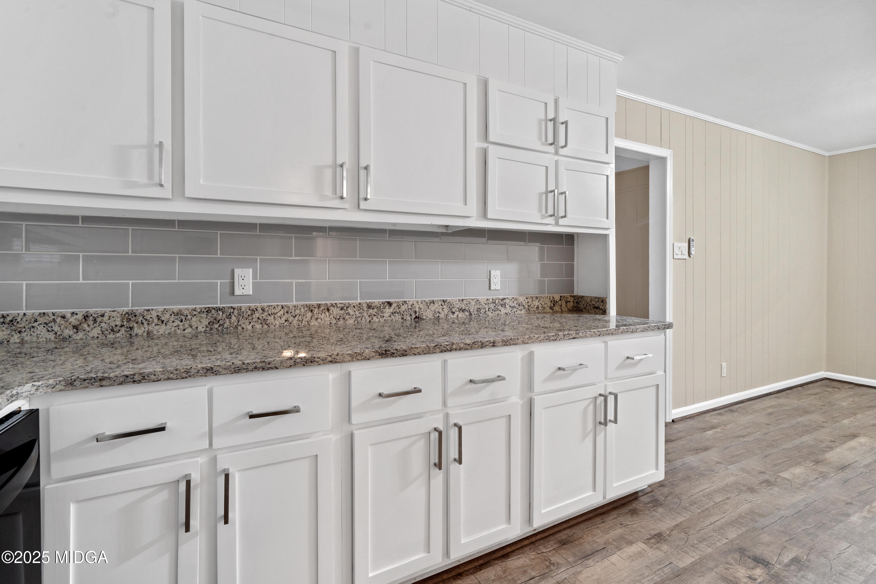 1303 Forest Hill Road Macon, GA 31210 - Photo 22 of 54 a kitchen with granite countertop white cabinets and a sink