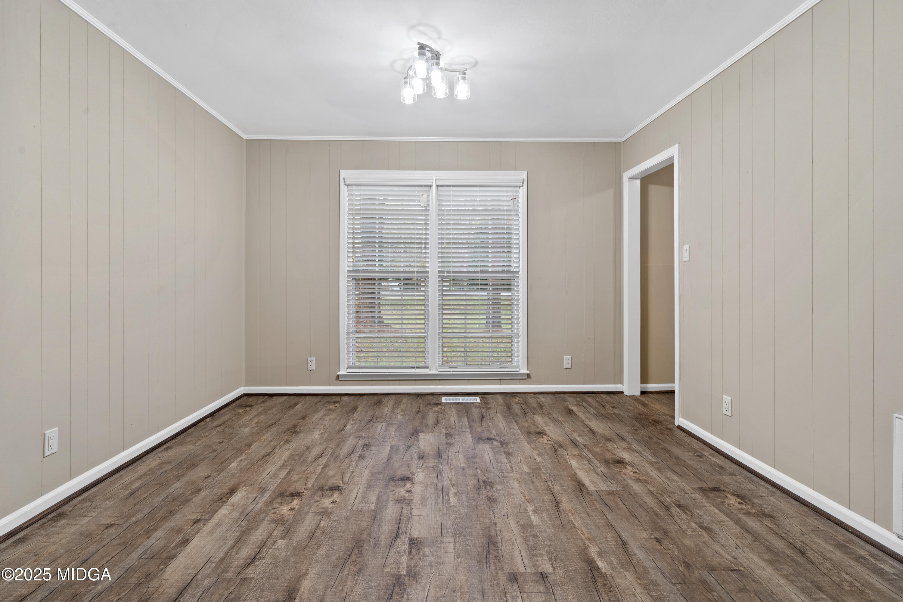 1303 Forest Hill Road Macon, GA 31210 - Photo 24 of 54 a view of an empty room with wooden floor and a window