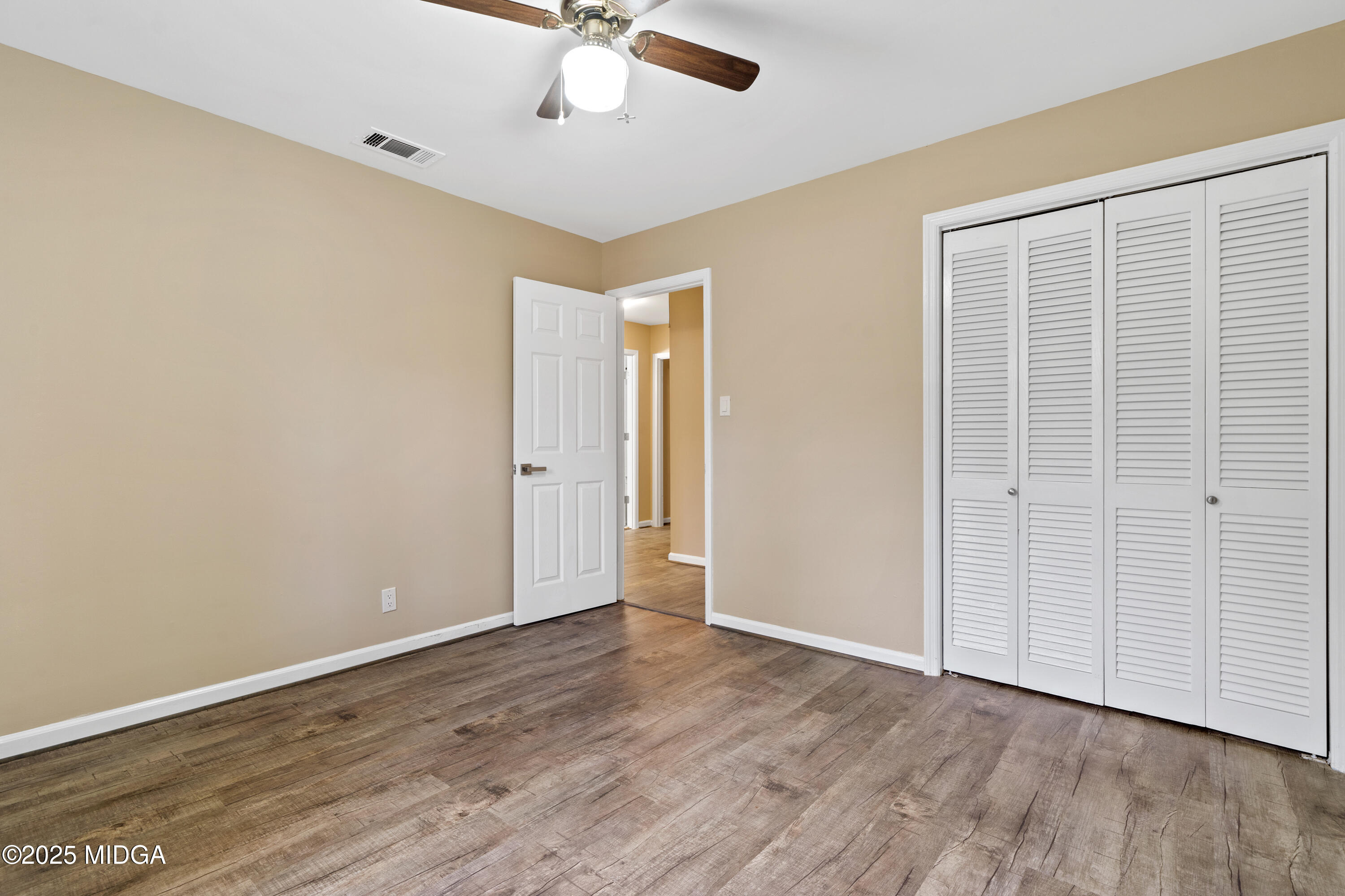 1303 Forest Hill Road Macon, GA 31210 - Photo 30 of 54 a view of an empty room with wooden floor