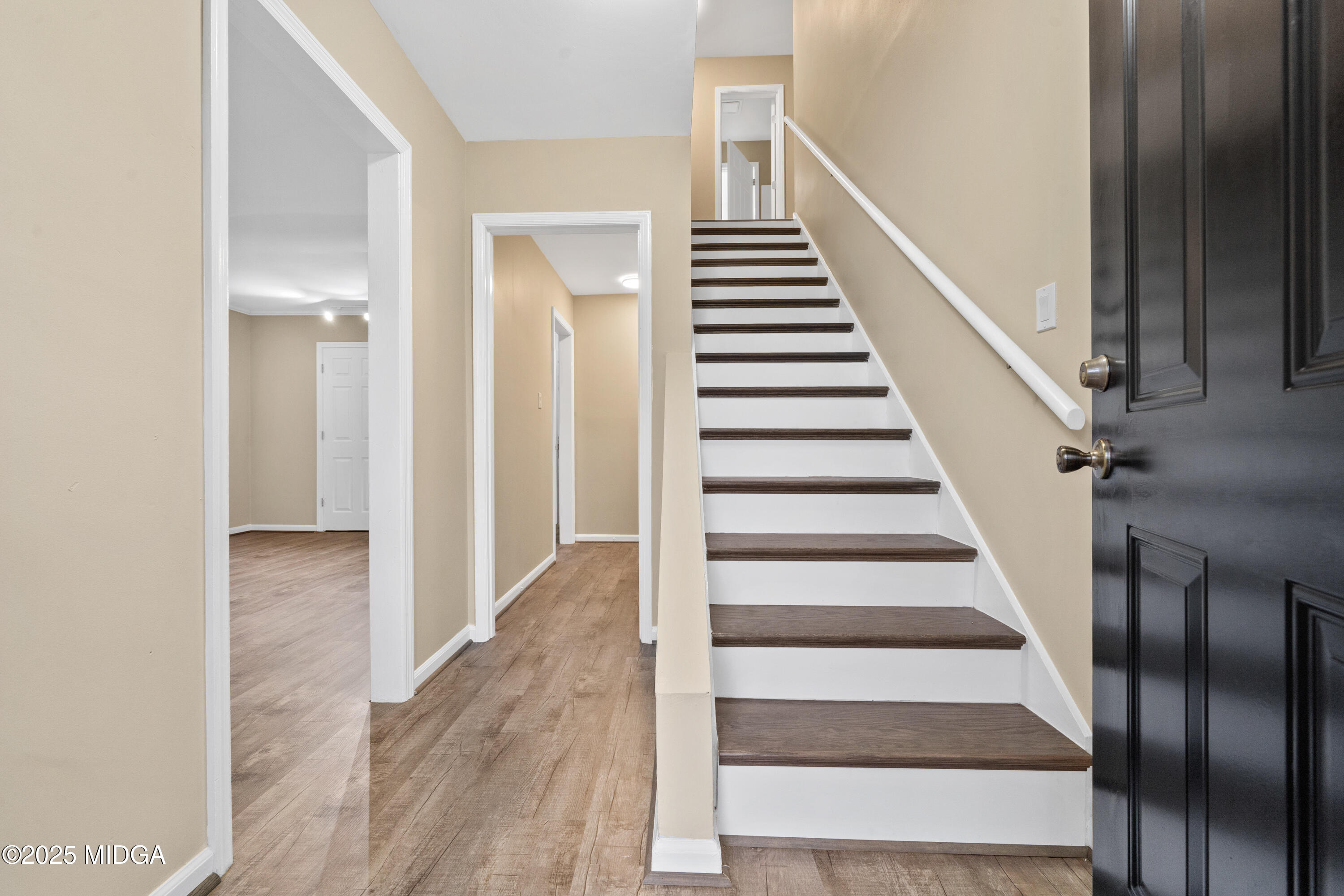 1303 Forest Hill Road Macon, GA 31210 - Photo 3 of 54 a view of a hallway with wooden floor and entryway