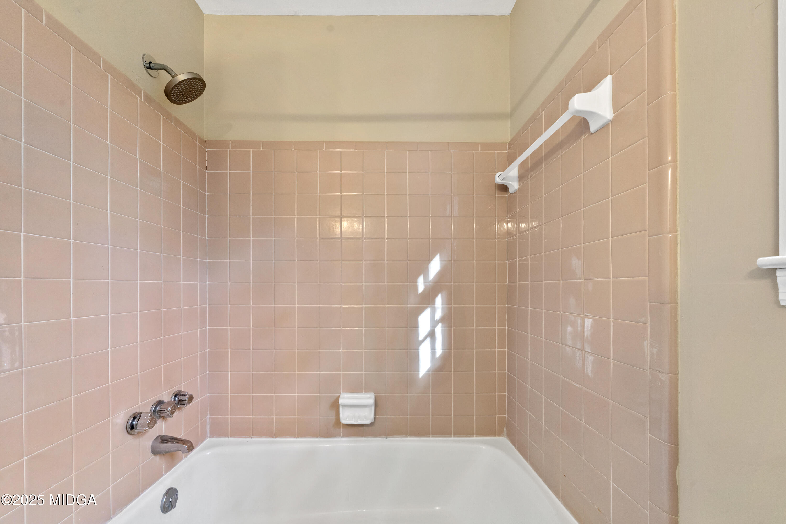 1303 Forest Hill Road Macon, GA 31210 - Photo 34 of 54 a bathroom with a shower and a bathtub