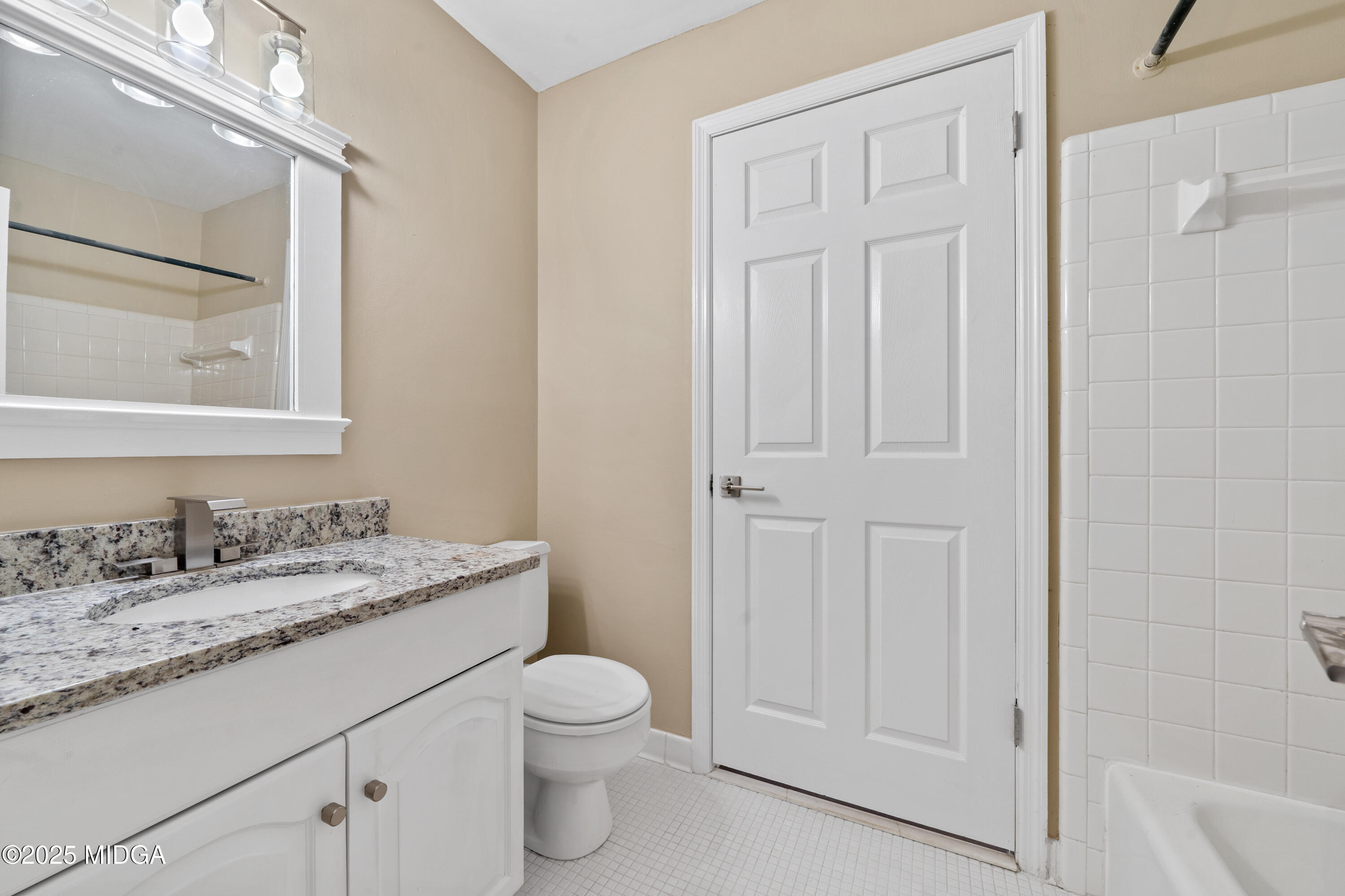1303 Forest Hill Road Macon, GA 31210 - Photo 35 of 54 a bathroom with a granite countertop sink toilet and shower