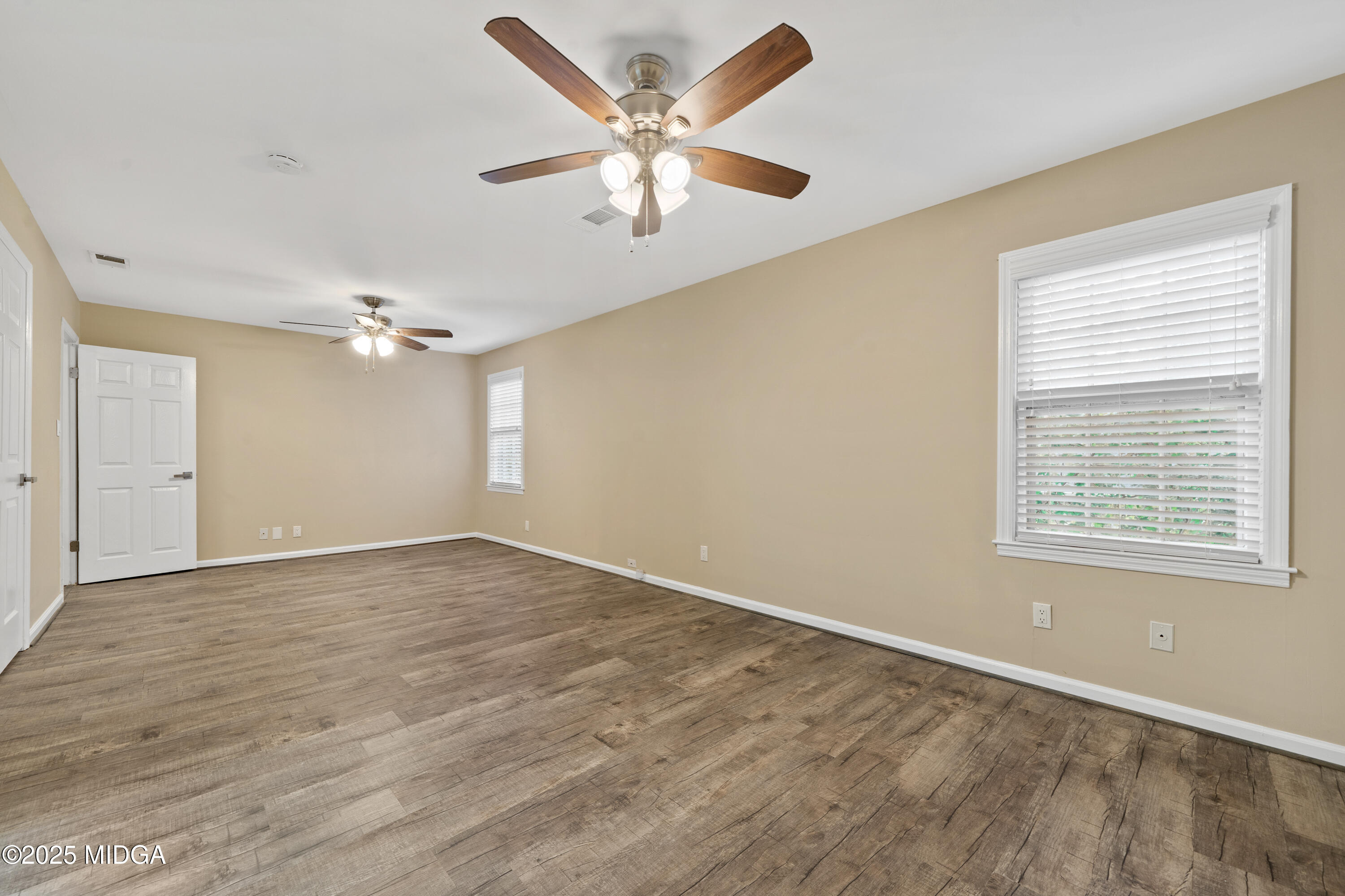 1303 Forest Hill Road Macon, GA 31210 - Photo 37 of 54 wooden floor in an empty room with a window