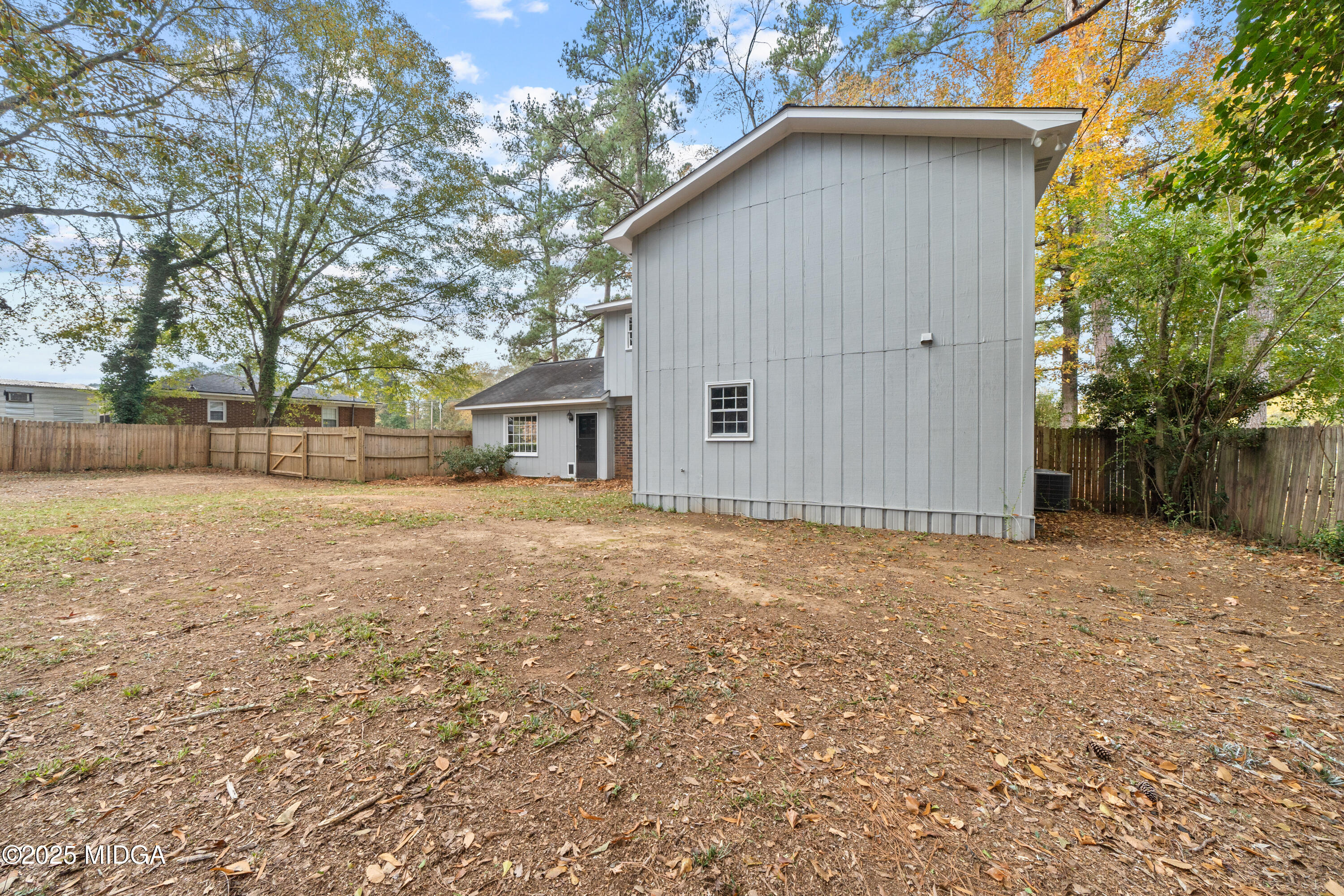 1303 Forest Hill Road Macon, GA 31210 - Photo 43 of 54 a backyard of a house with large trees