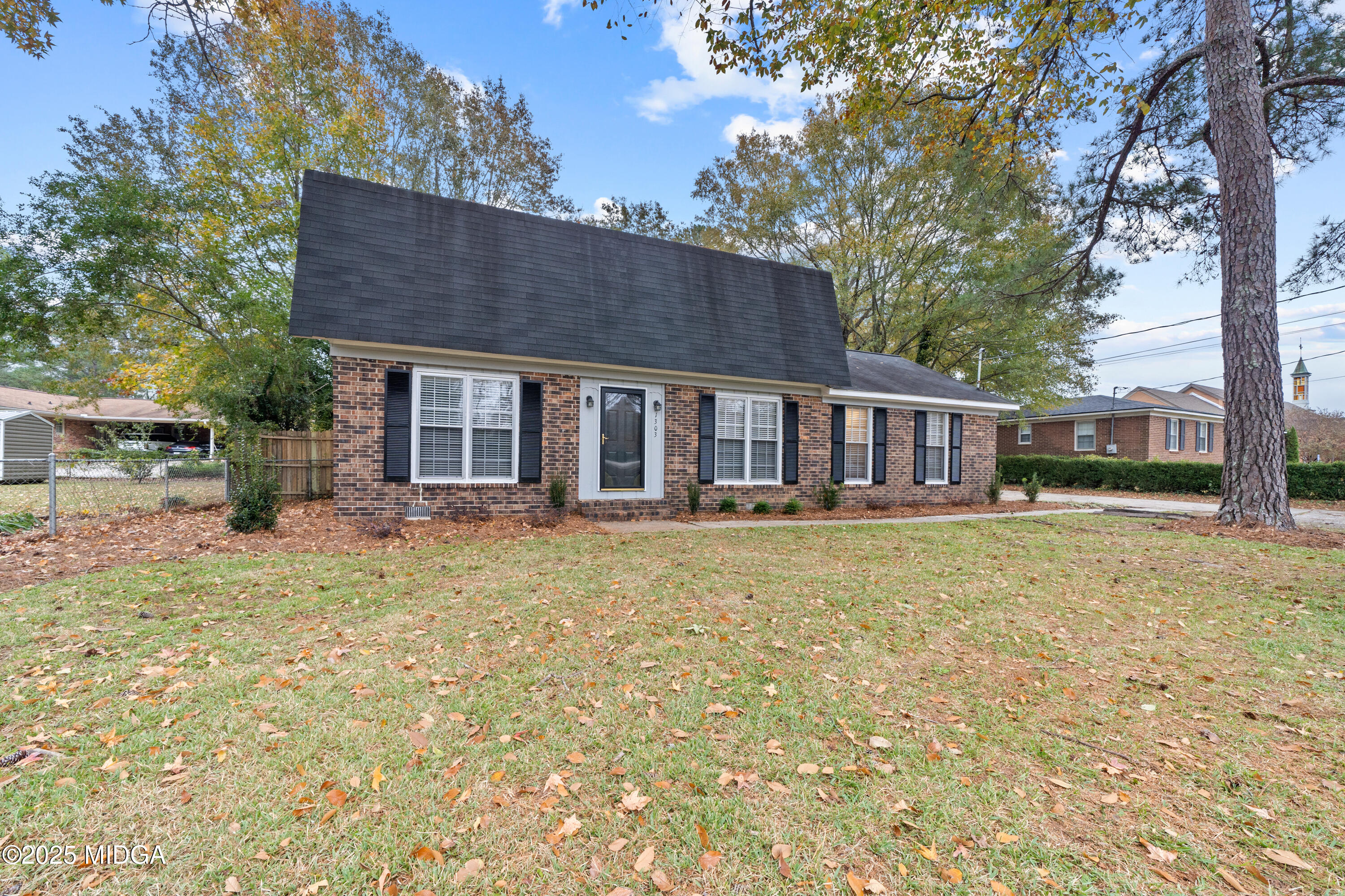 1303 Forest Hill Road Macon, GA 31210 - Photo 53 of 54 a view of a house with backyard and sitting area