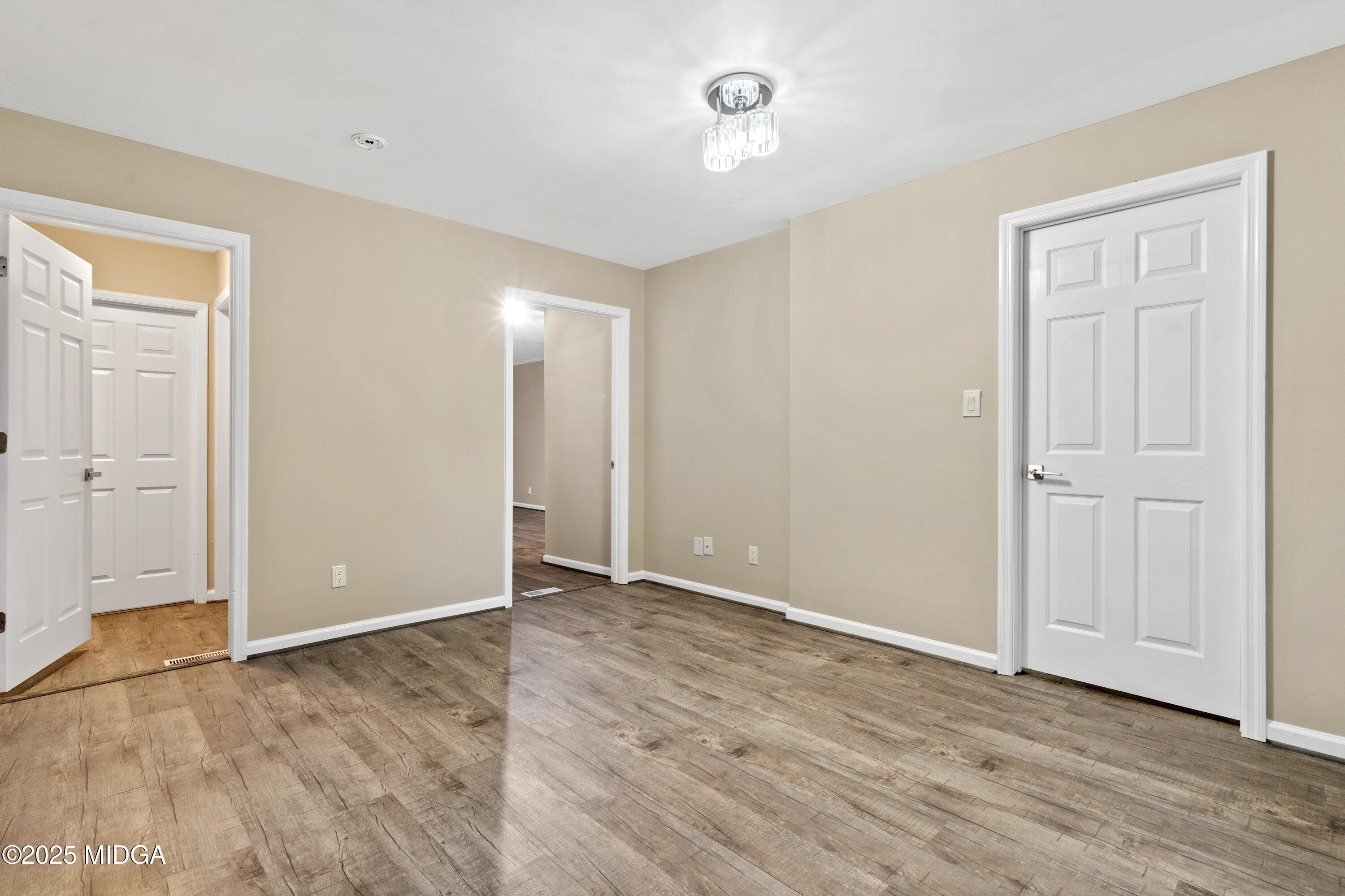 1303 Forest Hill Road Macon, GA 31210 - Photo 10 of 54 a view of an empty room with wooden floor