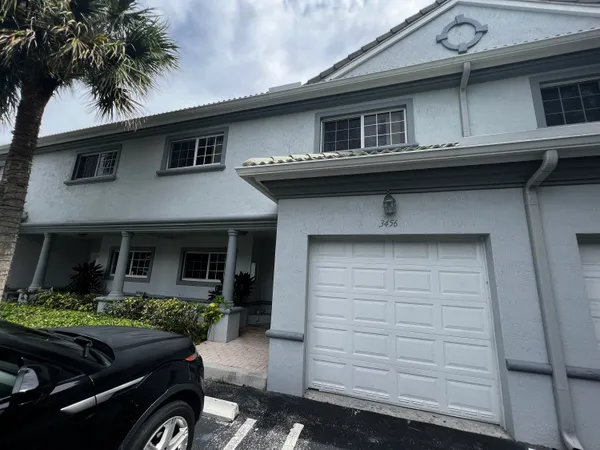 a front view of a house with garage