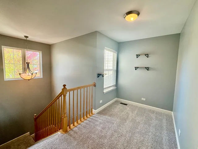 a view of a hallway with closet area