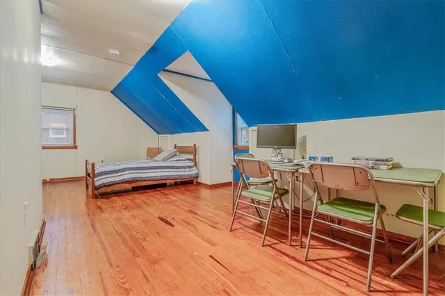 a bedroom with a bed and lamp