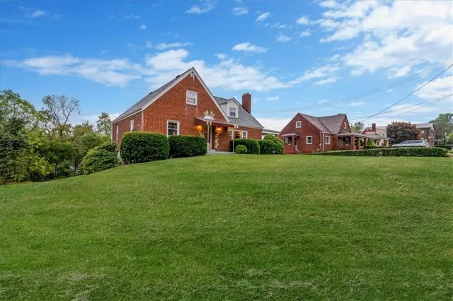 a front view of a house with a yard