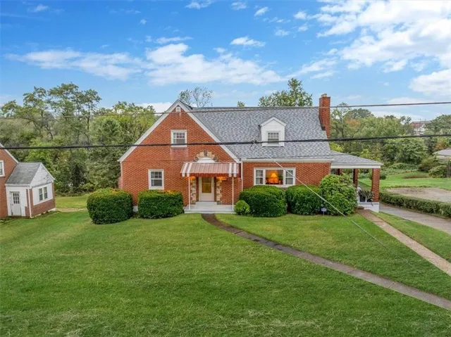 a aerial view of a house with a big yard