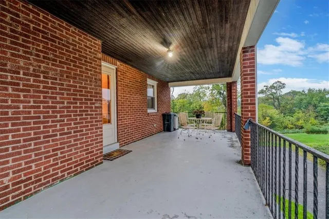 a view of a house with a floor to ceiling window and a big room
