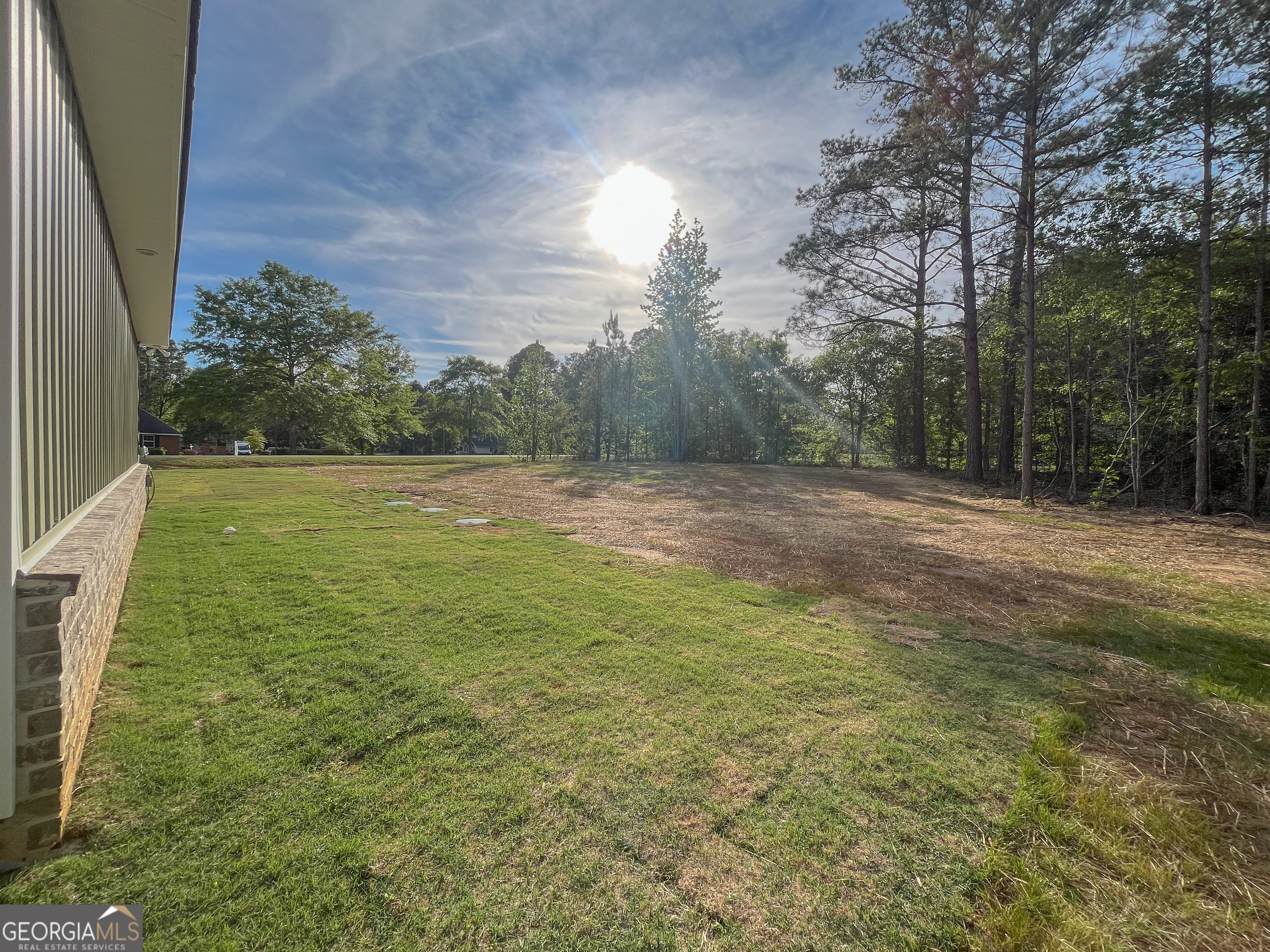 711 Flanders Lane Dublin, GA 31021 - Photo 38 of 49 a view of outdoor space with trees all around