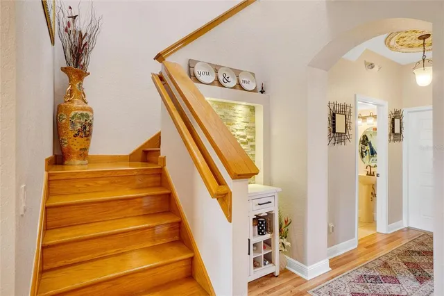 a view of an entryway with wooden floor