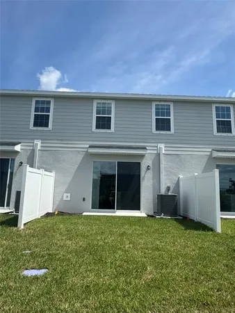 a view of a house with a yard and garage
