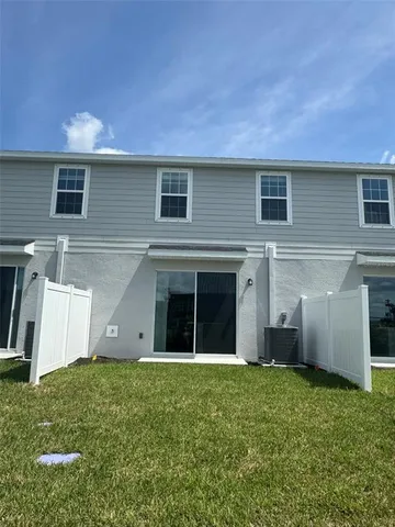 a view of a house with a yard and garage